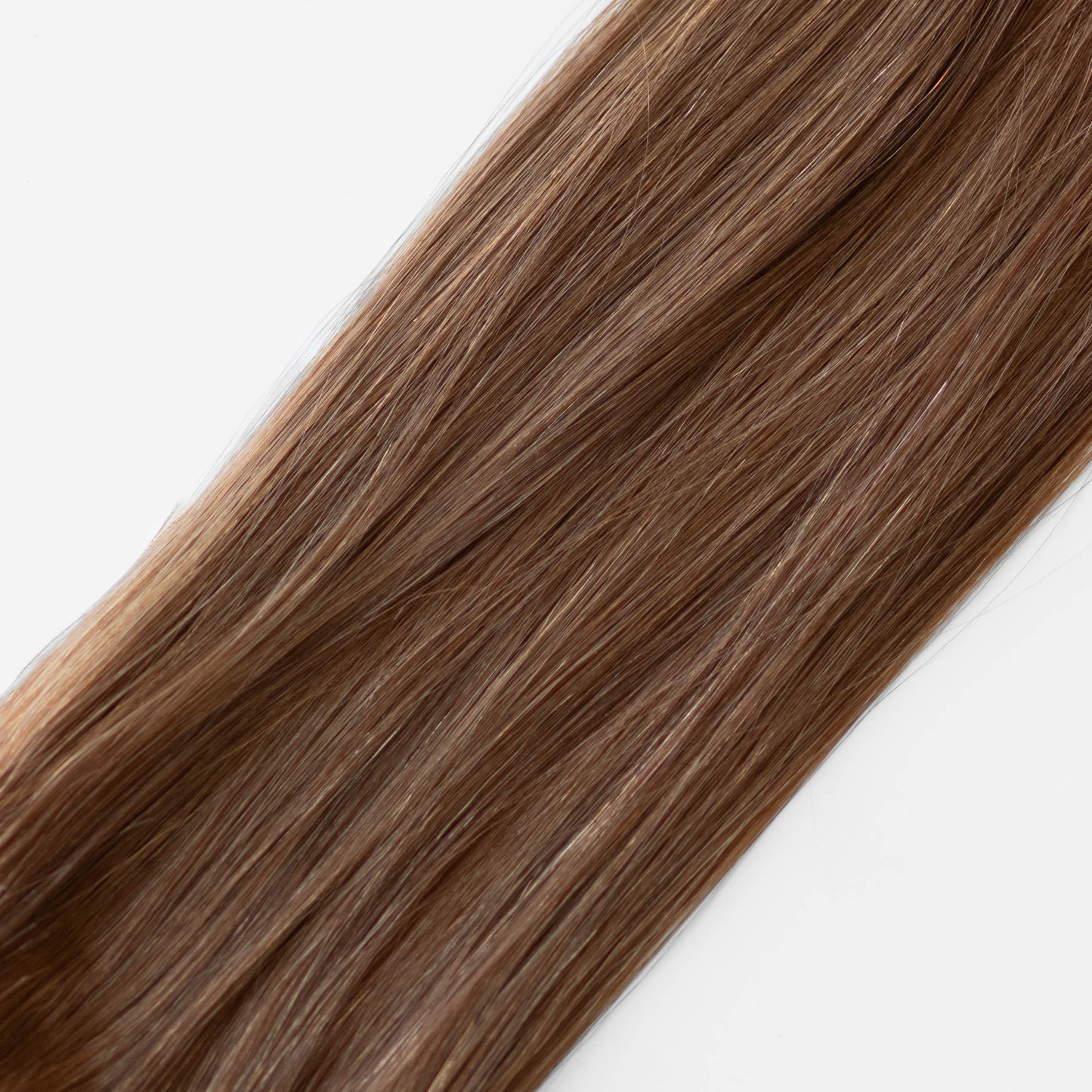Red brown hair extensions on a white background