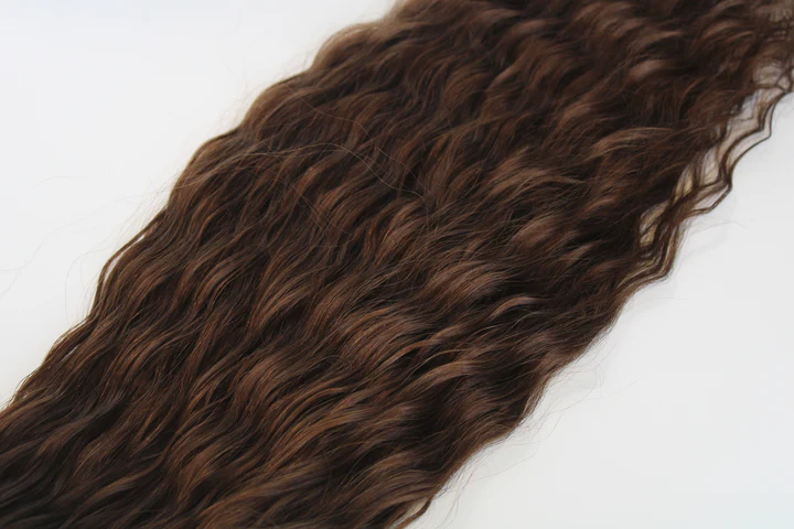 Brown hair extensions on a white background