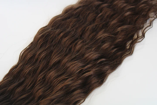 Brown hair extensions on a white background