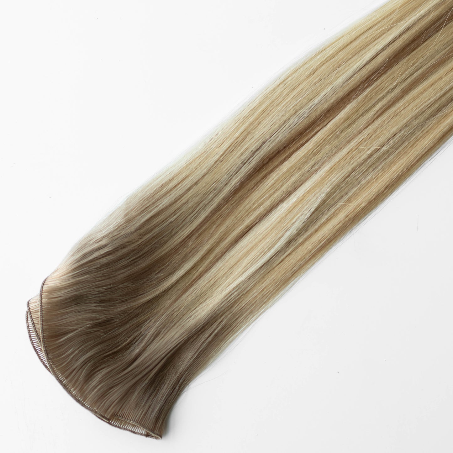Blonde hair extension on a white background