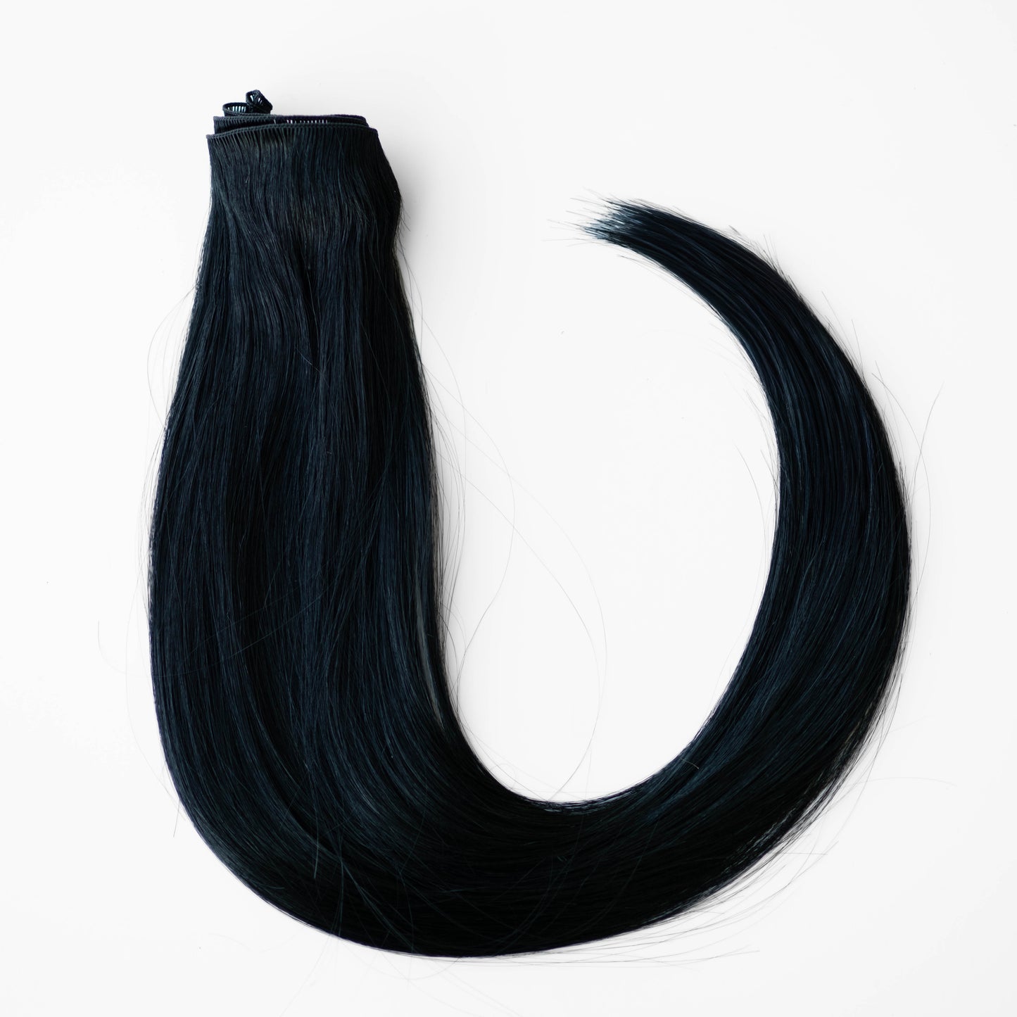 Black hair extensions on a white background