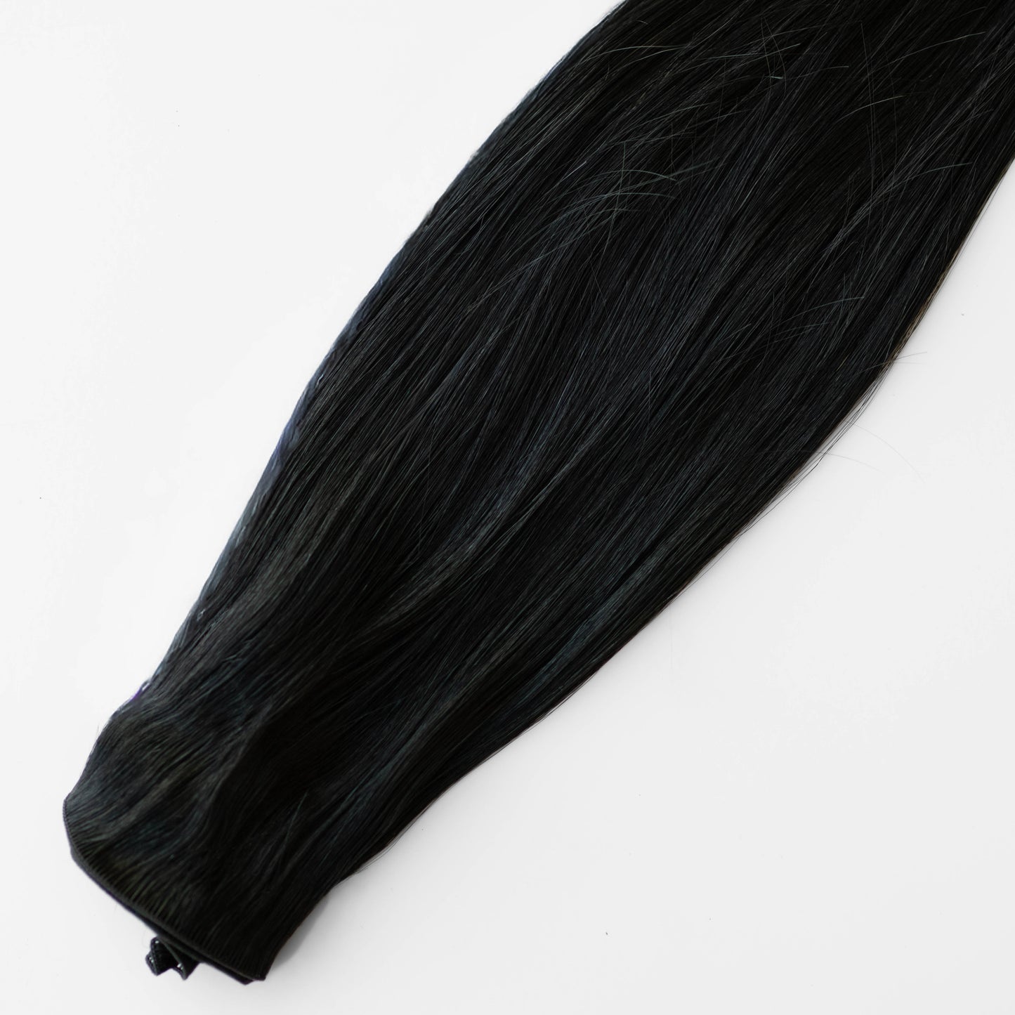 Black hair extension on a white background