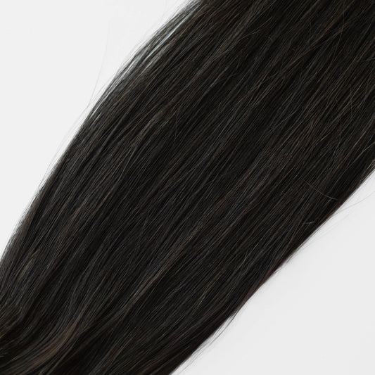 Dark Brown hair extension on a white background