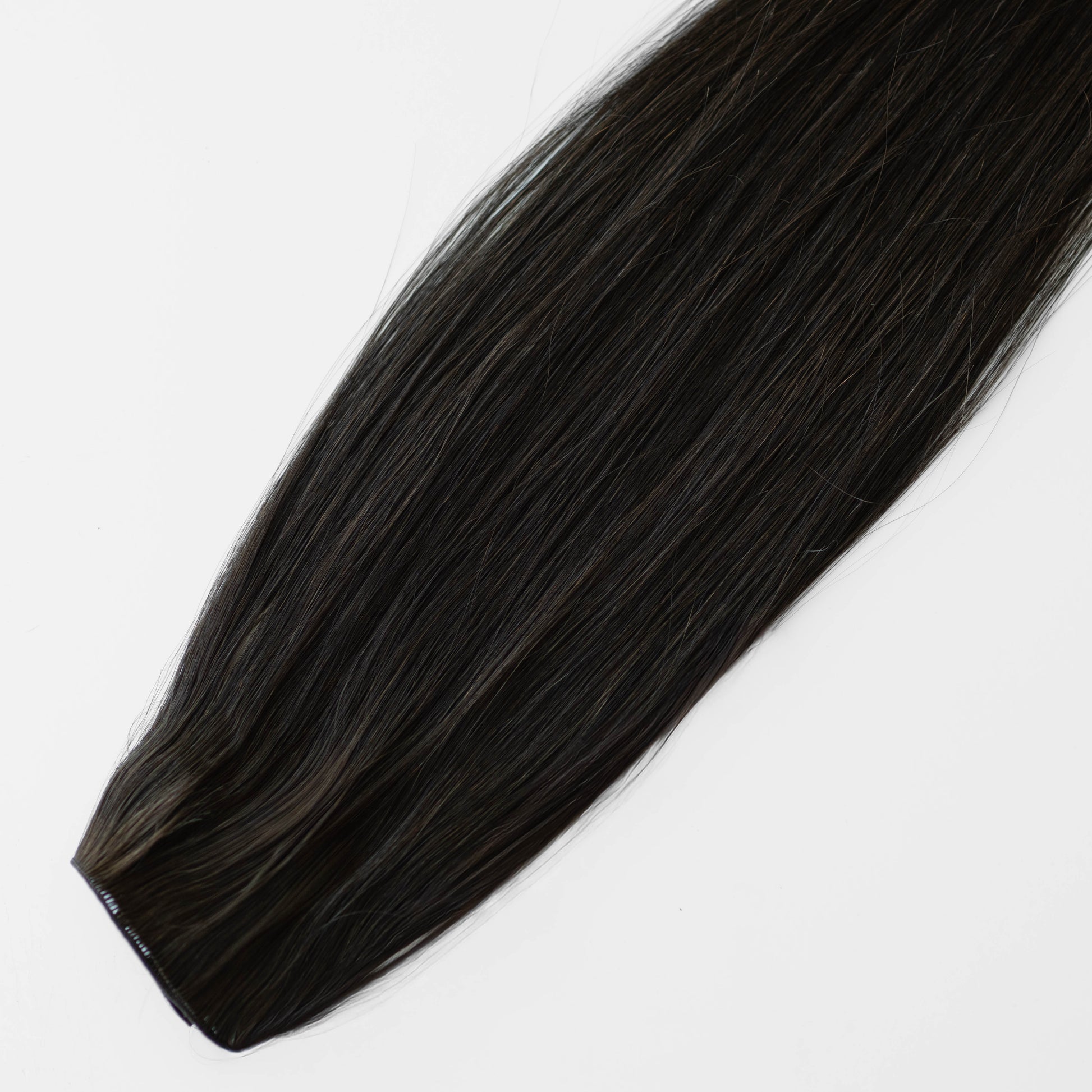 Dark Brown hair extension on a white background