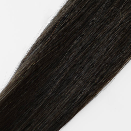 Dark Brown hair extension on a white background