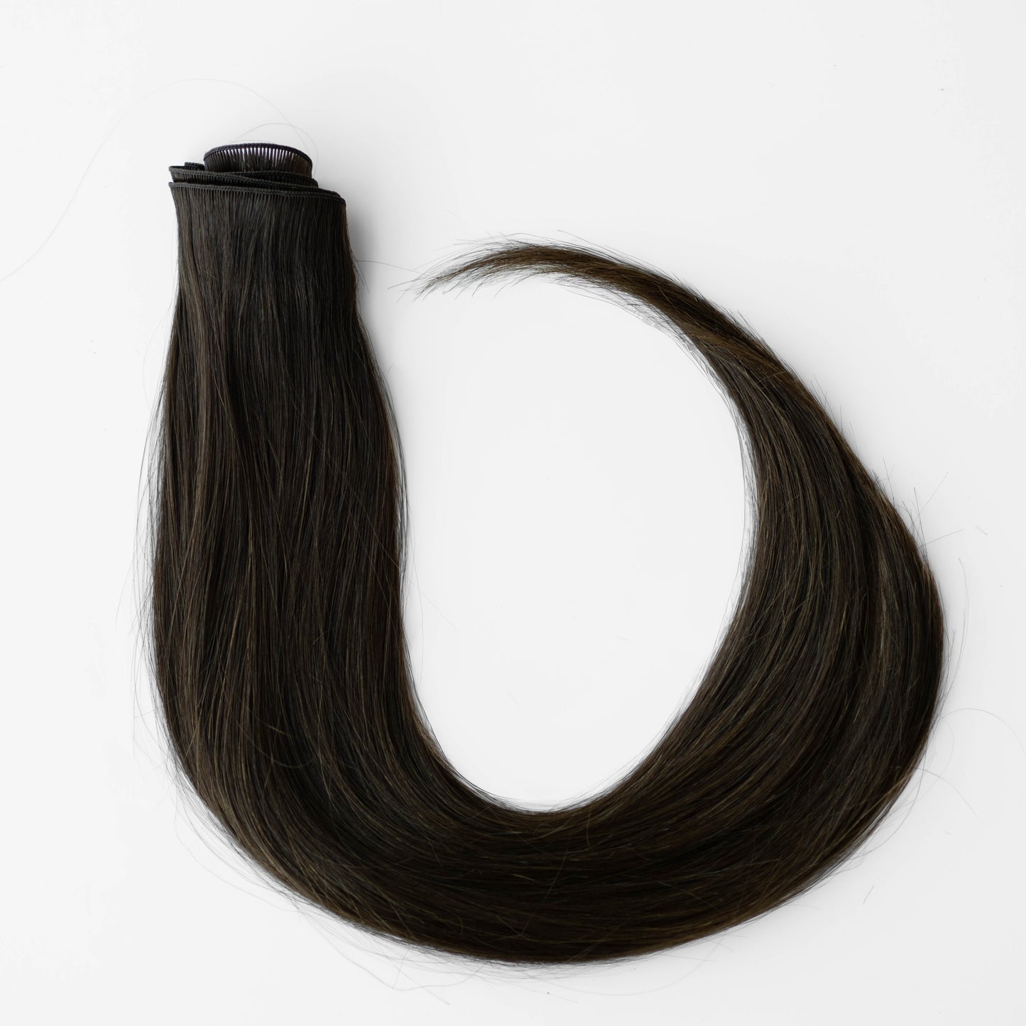 Dark brown hair extensions on a white background