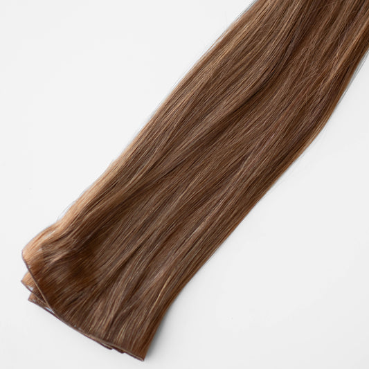 Red brown hair extensions on a white background