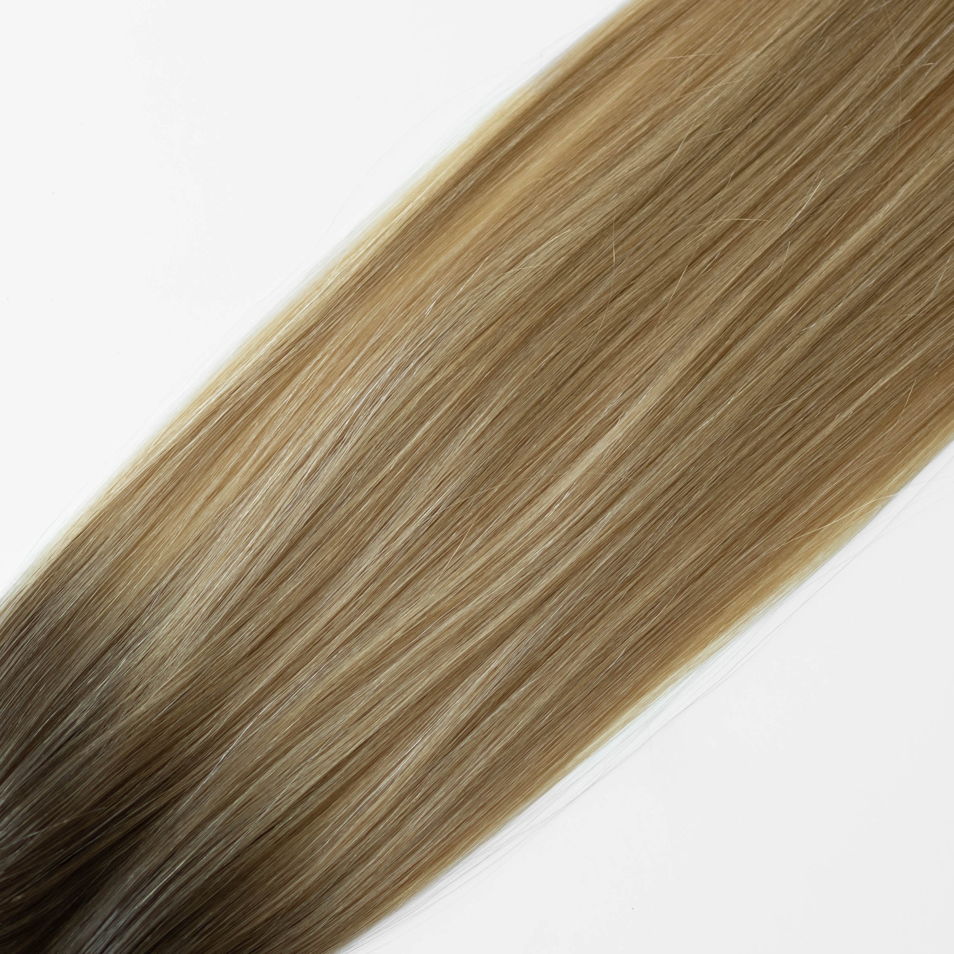 Blonde hair extensions on a white background