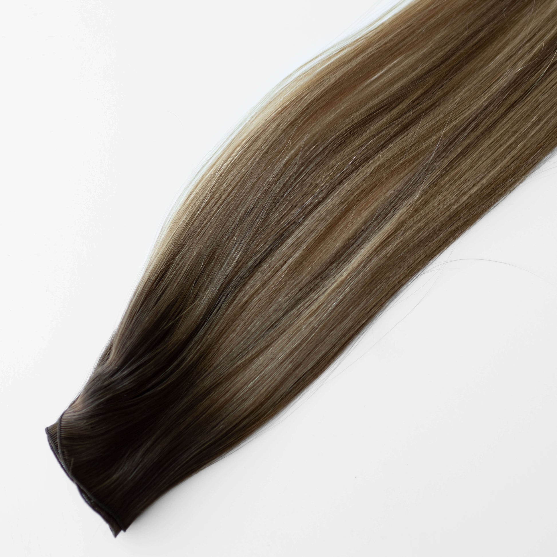 Brown hair extension on a white background