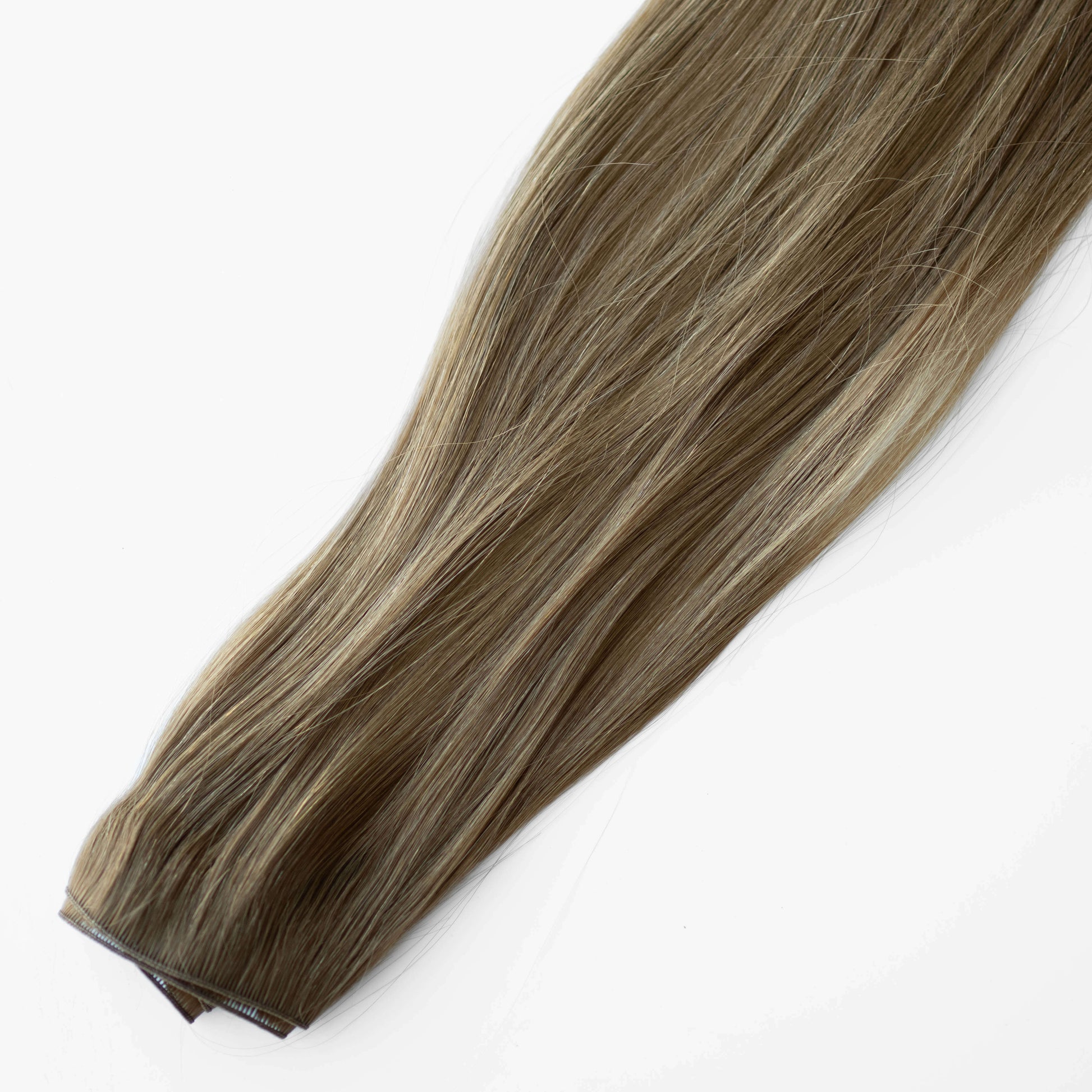 Brown hair extension on a white background
